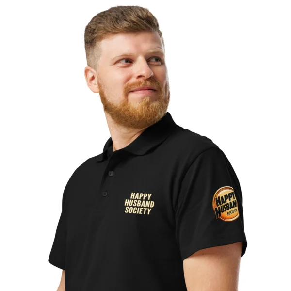 Black Happy Husband Society Premium Polo with happy husband society badge on left sleeve — funny husband gift shirt for men
