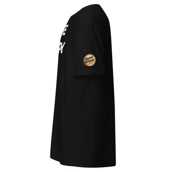 Side view of the Happy Husband Society T-Shirt in Black. Features White Wife N Happy D hidden text on the chest and the official Happy Husband Society Gold Badge on the sleeve.